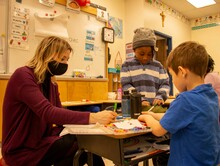 Photo of teacher and students